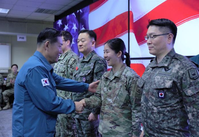 Defense Minister Shin Won Sik (far left) visits th
