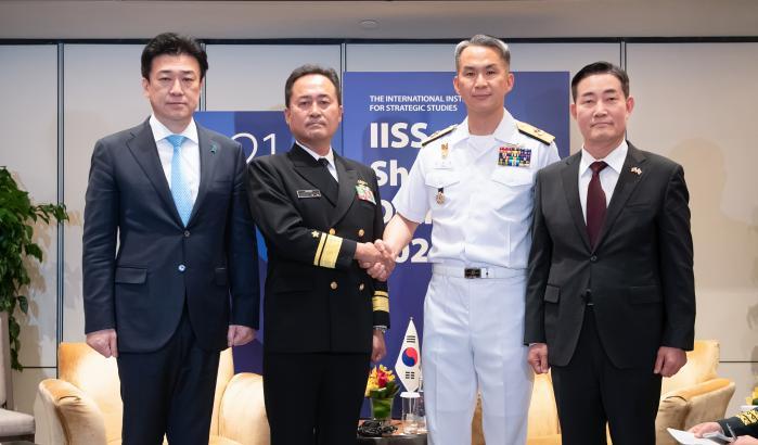 South Korean Defense Minister Shin Won Sik (far ri