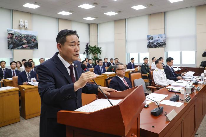 Defense Minister Shin Won Sik gives the opening sp